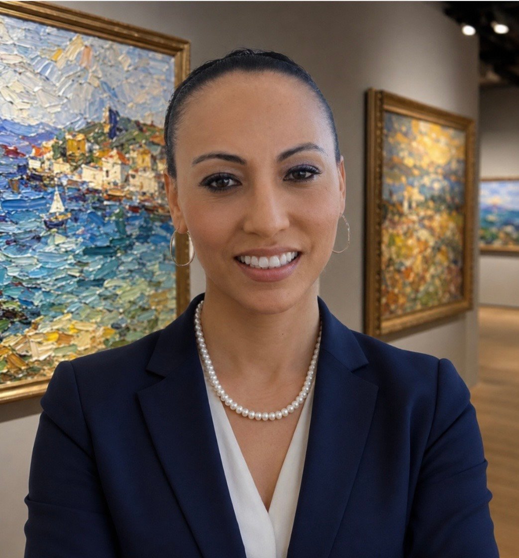 Pandora E. Paris, founder, standing before culinary works from the collection